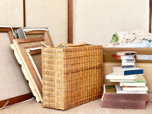 Estate items are stacked up in a corner. They are unsold.